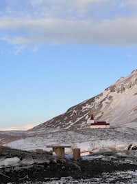 a skier is skiing down a snowy slope